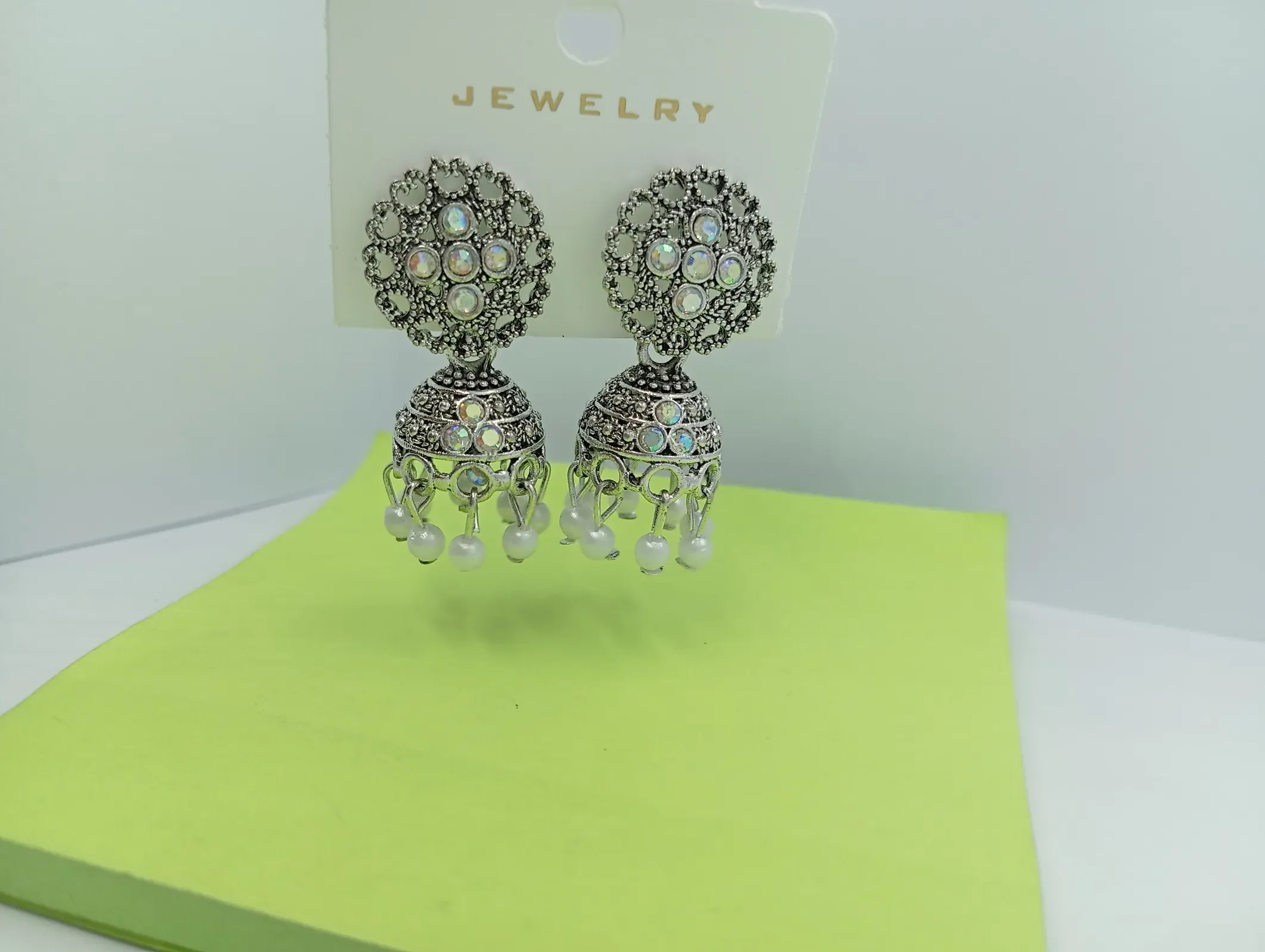 Oxidised Stone Studded Jhumka Earrings with White Beads