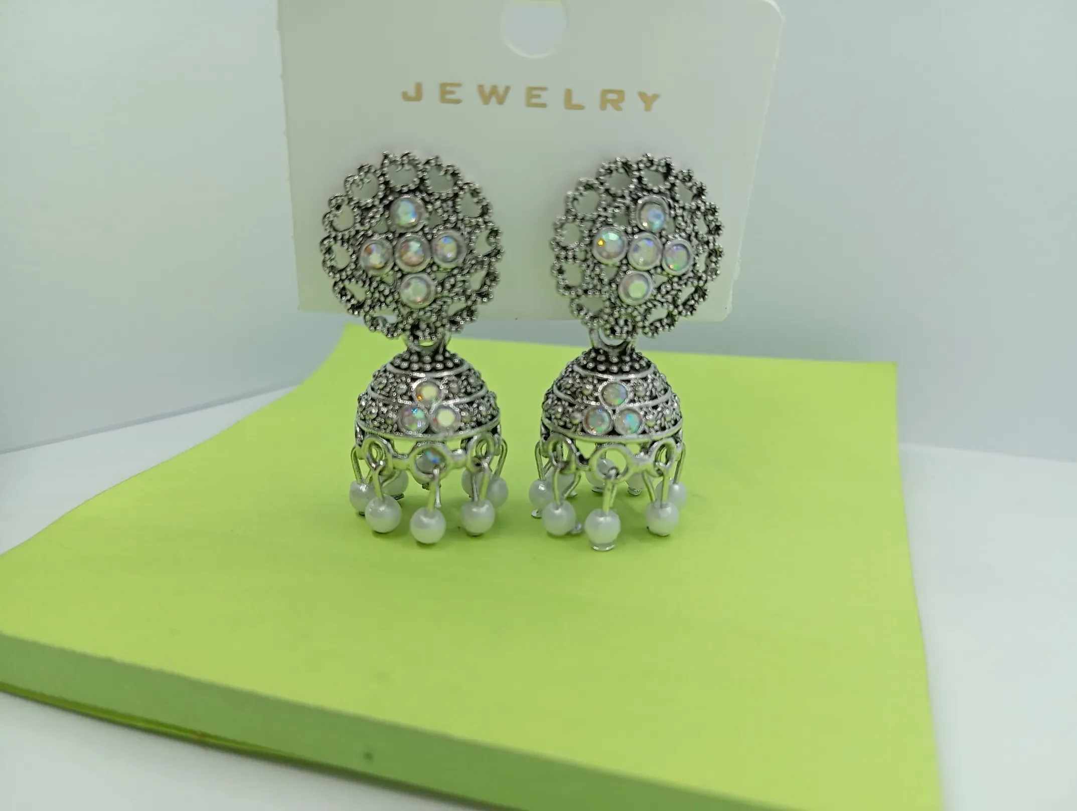  Oxidised Stone Studded Jhumka Earrings with White Beads