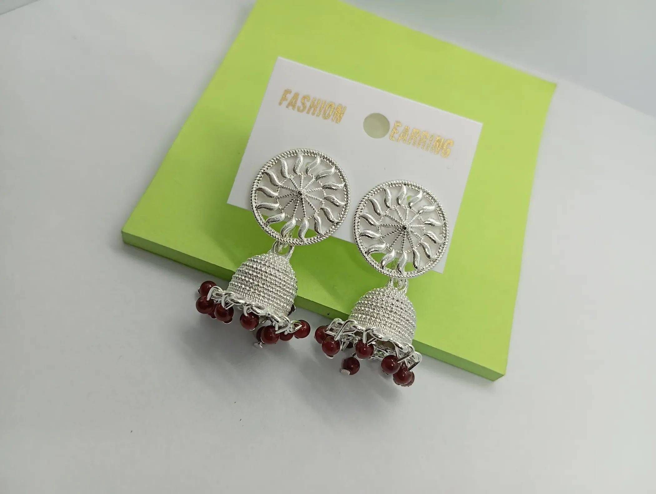 Silver Chakra Jhumka Earrings with Maroon Beads